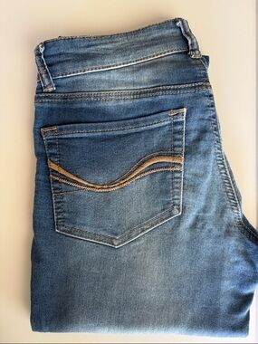SO Women's Skinny Jeans in Faded Blue with Tan Stitching